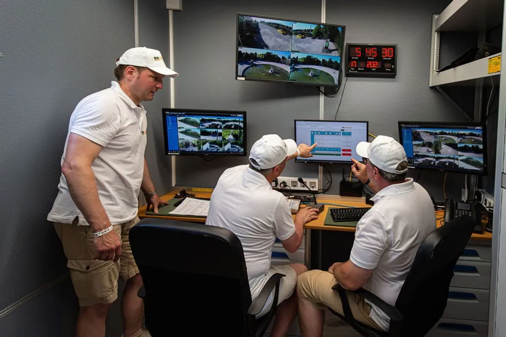Team in the mobile MOVETOS control room in front of the camera views